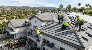 Licensed roofing team installing new tiles on modern Southern California home roof with scenic hills background